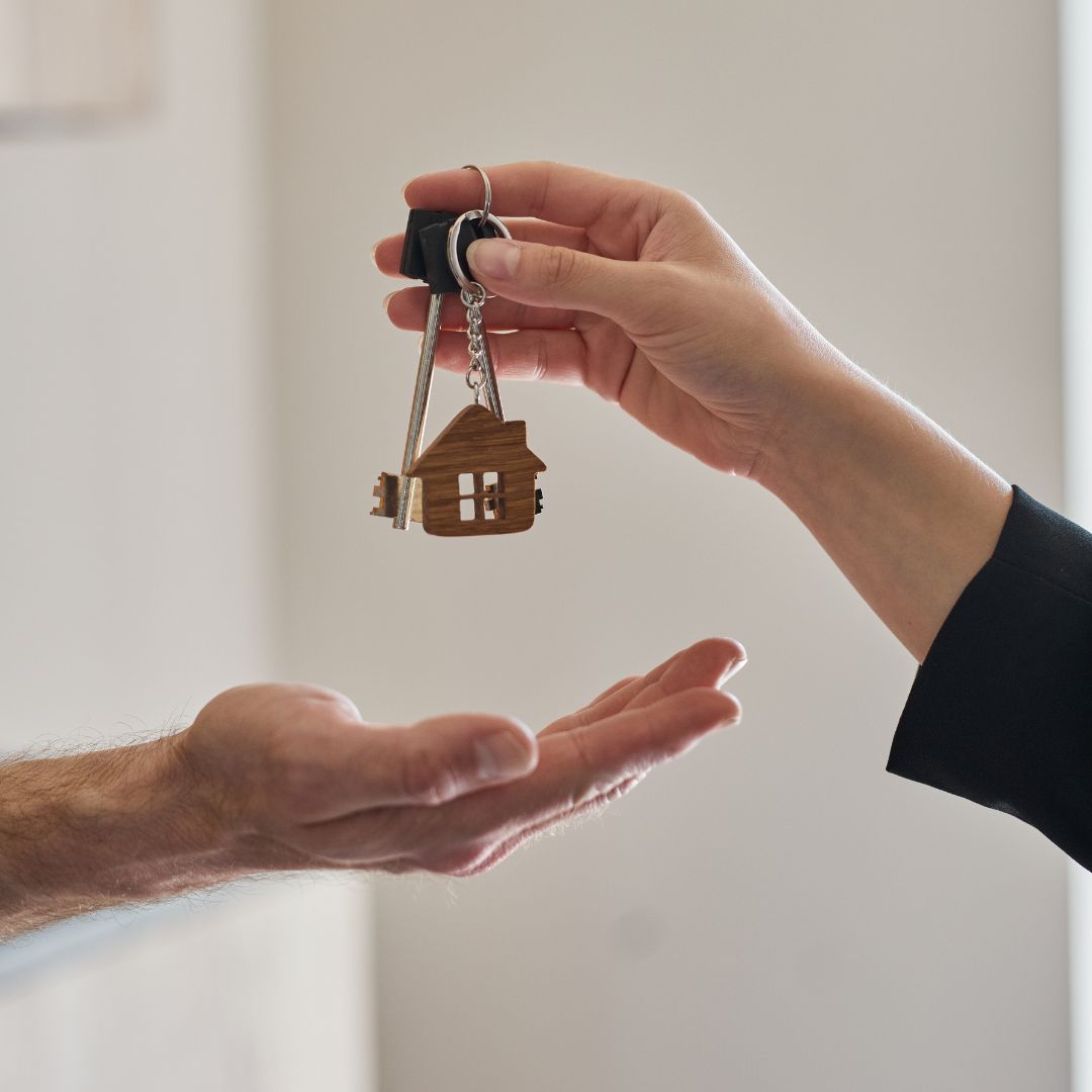 Realtor giving keys to new homeowner